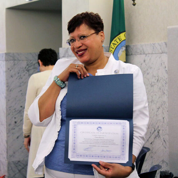 woman holding certificate of participation
